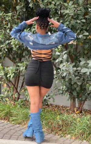 Fashion-forward ripped short denim jacket, ideal for layering and adding edge to your look