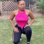 Woman wearing a stylish hot pink open back halter top