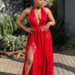 Elegant red maxi dress for women in Johannesburg, perfect for evening events and parties, with a stylish slit design for added allure.