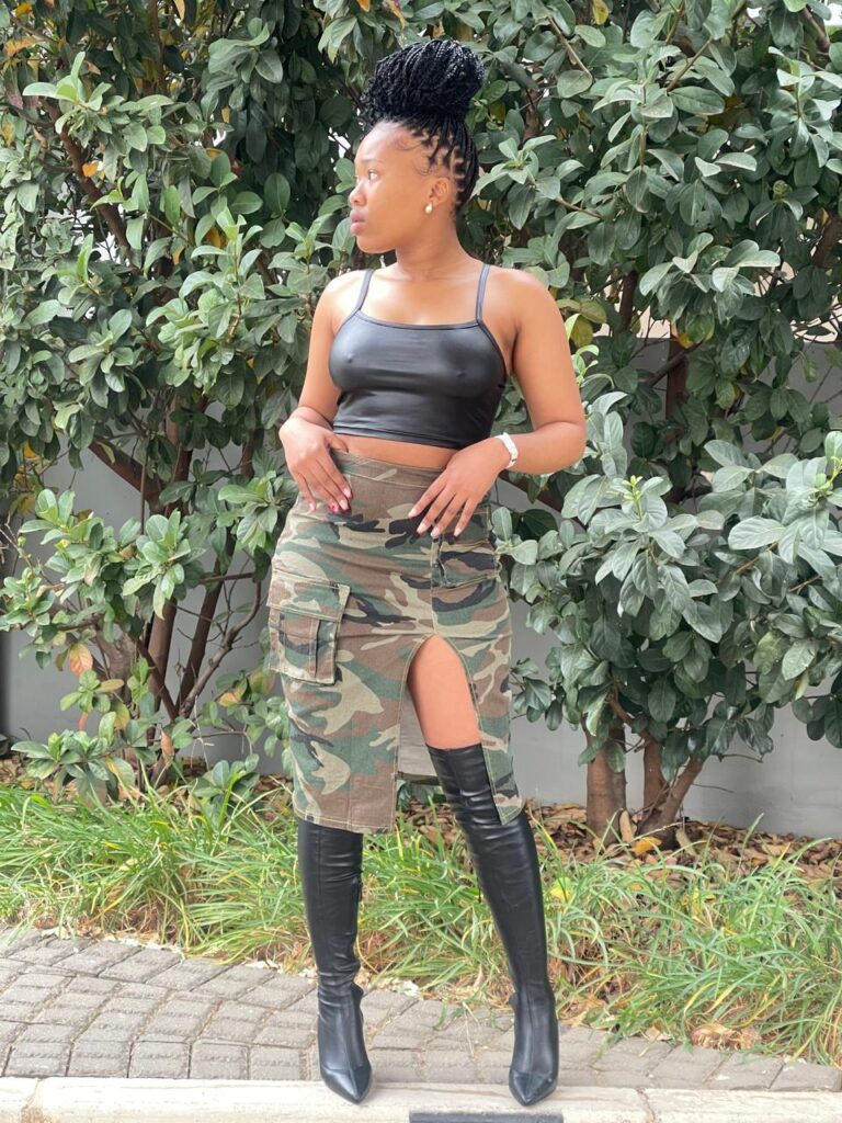 Trendy black crop top, camouflage skirt, and thigh-high boots for women in Johannesburg – perfect for bold streetwear and edgy fashion.